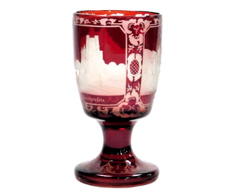 A late 19thC German ruby glass goblet, reserve etched with views of Drachenfels, Stalhenfels and Johannisberg castles, 16cm h