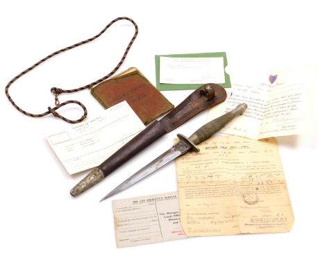 A Fairbairn Sykes 1st pattern fighting knife, by Wilkinson Sword, London, with leather sheath, blade 17cm long, together with