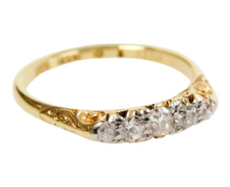 An 18ct gold and diamond five stone ring, approx ¼ct, size M, 2.5g.
