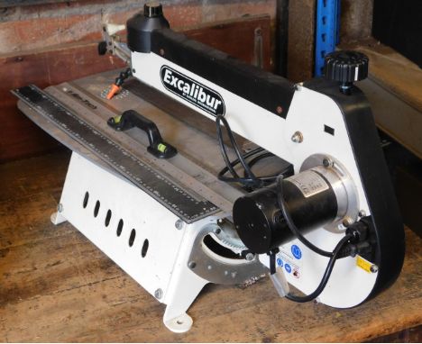 An Excalibur EX21 scroll saw, serial number 21847512, together with rulers and set squares, one with a spirit level set handl