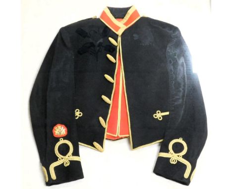 An Army Warrant Officer's mess dress jacket, in black and red, with gold frogging, framed and glazed, frame, 98cm x 87cm.