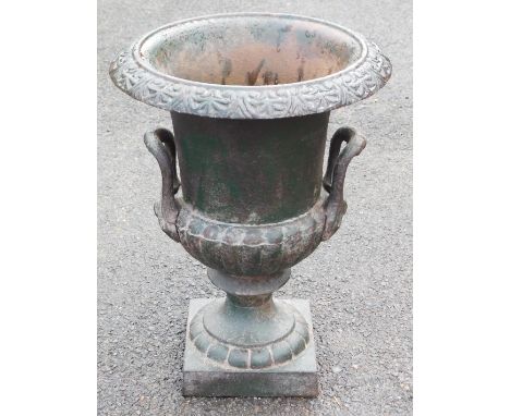 A Victorian cast iron garden urn, painted green, of campana form, 42cm high.