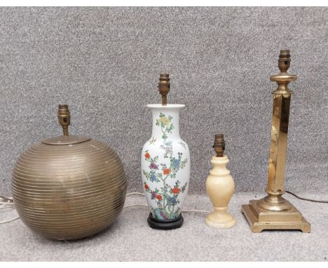 A collection of four table lamps to include, one ribbed ceramic of globular form, one Oriental style baluster vase with hand 