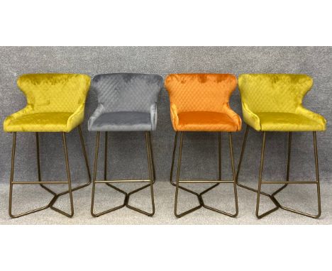 A set of four vintage style brushed velvet wingback bar stools on tubular supports. H.99cm.