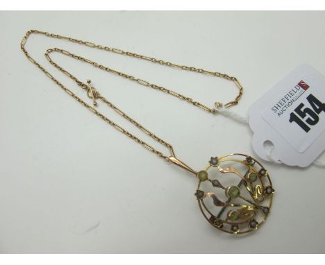 An Edwardian Pendant/Brooch, of circular openwork design, with seed pearl and cabochon highlights, stamped "9ct", on alternat