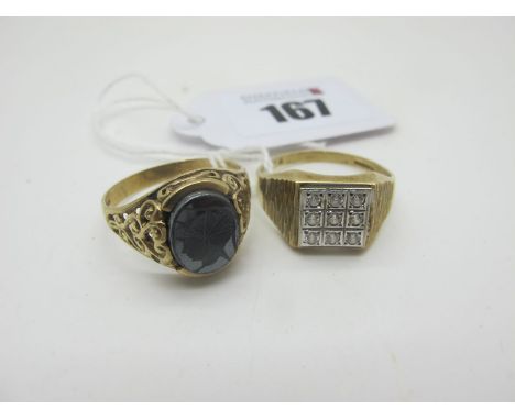 A 9ct Gold Gent's Signet Ring, with oval hardstone panel depicting centurion profile, between openwork scroll setting and sho