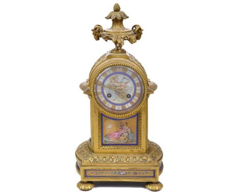 A 19th Century Ormolu Mantel Clock with Porcelain Dial:The case set with six gilded ceramic panels of Neo-Classical scenes an