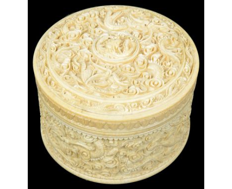 A Chinese Canton export ivory powder box with lid19th centuryOf cylindrical shape. Intricately decorated throughout with sinu