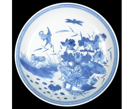A 19th Century Blue and White Charger With Kangxi Marks:Depicting ducks on pond   CONDITION REPORT:  In good original conditi