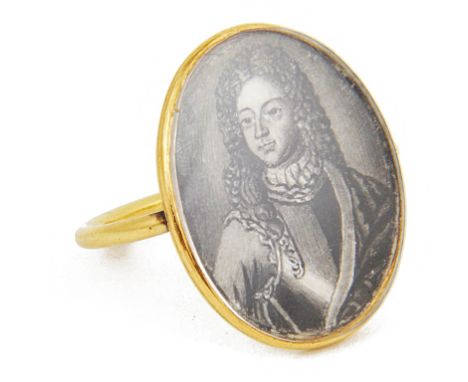 An 18th Century Memento Mori Ring of The Old Pretender:Unhallmarked gold ring set with ink drawing of the Old Pretender, the 