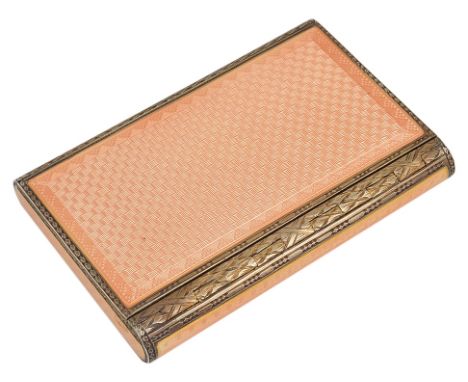 A Silver Gilt & Guilloche Enamel Box, c1927:Engine turned silver box with slide top in a salmon orange enamel, opens to revea