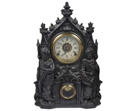 A Waterbury Alarm Peter & Paul Mantel Clock with Cast Front: The cast metal front set with two glazed brass apertures for dia