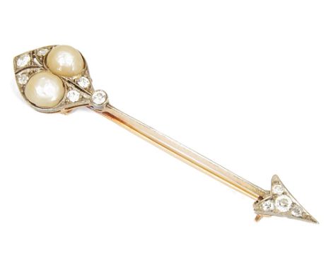 A Victorian Diamond and Pearl Arrow Brooch:Unhallmarked gold stylised arrow on original pin set with 10 diamonds and two pear