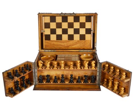 A Walnut Boxed Games Compendium:To include chess, draughts, backgammon, dominoes, the box being decorated with metalwork