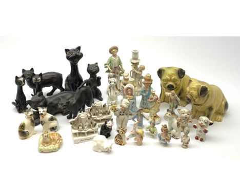 A collection of various ceramic figurines, to include pair of small 19th century Staffordshire cats, Royal Doulton cat, Coalp