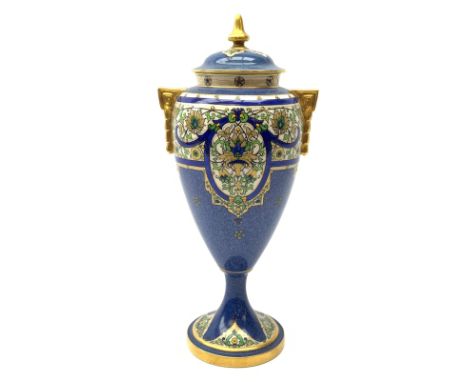 An early 19th century Royal Worcester porcelain vase and cover, of baluster form with twin gilt handles, raised upon a spread