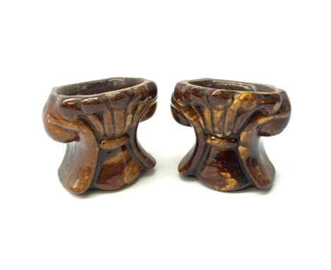 A pair of 19th century treacle glaze pottery sash window rests, H10.5cm. Click here to view further images, condition reports