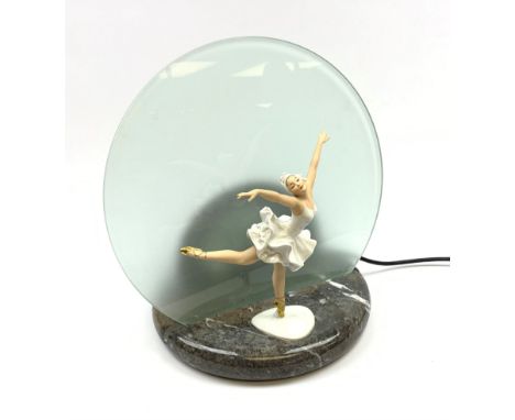 A table lamp with circular frosted glass shade, behind a later mounted continental figure modelled as a ballet dancer, H37cm.