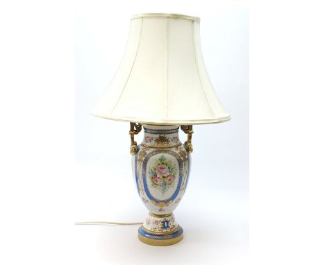 A Sevres style table lamp, of baluster form with twin gilt scroll handles, the body decorated with hand painted flowers conta