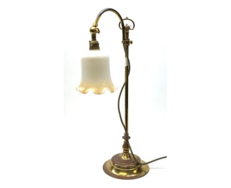 A brass rise and fall students lamp, with opaque white frilled glass shade, H55cm.Click here to view further images, conditio