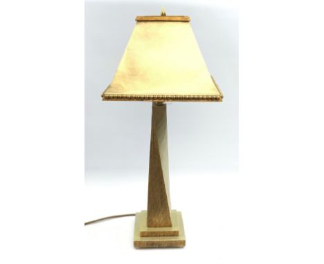 A two tone gilt table lamp, with twisted stem upon a square stepped base, supporting a conforming square tapering shade, over