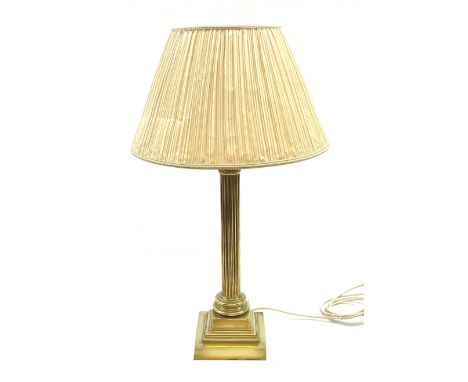 A brass Corinthian column table lamp, on stepped square base, including fitting H57cm, with pleated shade.Click here to view 