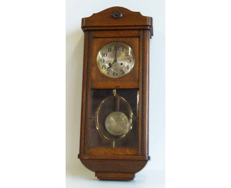 Early 20th century oak 8-day wall clock. No condition reports for this sale.