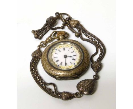 A lady's small silver pocket/fob watch on a silver albert chain. No condition reports for this sale.