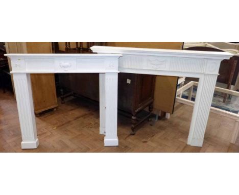 White painted wooden fire surround and fibreglass ditto. No condition reports for this sale.