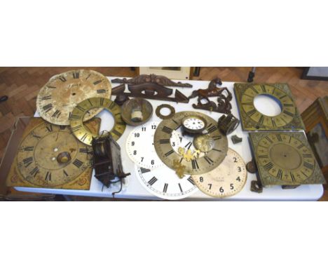 A large assortment of high quality clock parts, including two brass faces with brass spandrels and one clock movement No cond