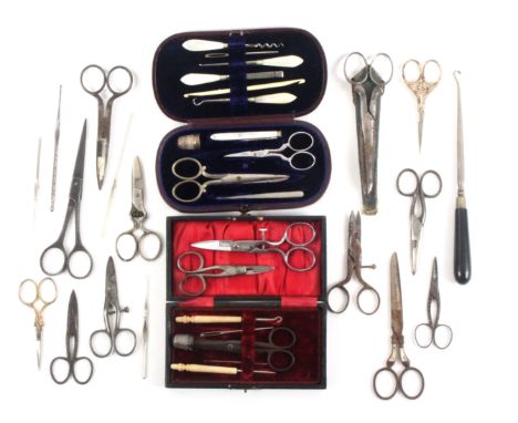 A mixed lot - sewing, comprising two cased sewing sets one with mother of pearl tools, one pair of scissors matched, 17cms, e