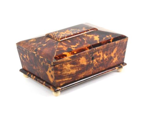 A fine fitted tortoiseshell sewing box with details of ownership, circa 1835, the box of sarcophagal form raised on ivory bal