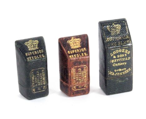 Three leather slant top needle packet boxes relating to Rodgers, comprising a dark green example the top with gilt crown and 
