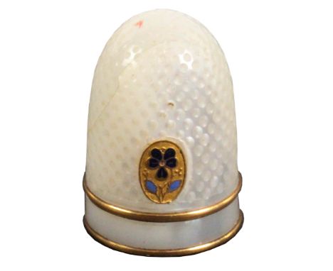 A Palais Royal thimble, with double gilt band and oval gilt metal and enamel pansy motif, cracks or natural faults to pearl, 