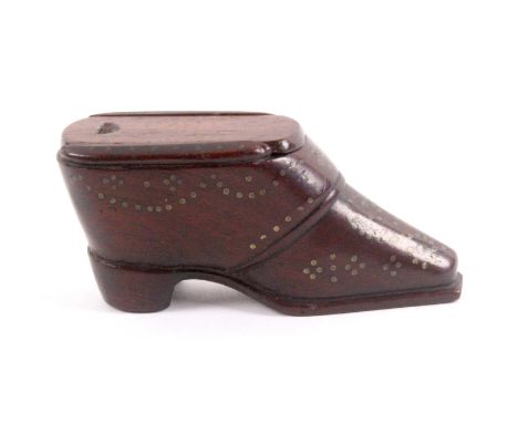 An early 19th Century mahogany shoe form snuff box, the flattened toe below 'S' form brass pique work, the sides with further