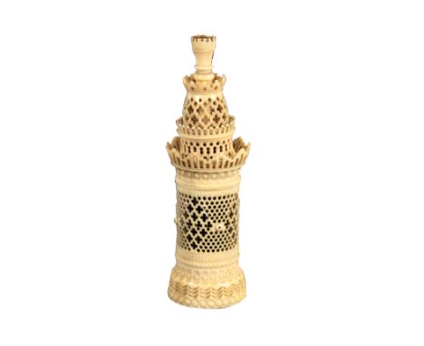 An exceptional engine turned and pierced ivory sewing companion, Palais Royal, circa 1820, of tower form, the cylinder body f