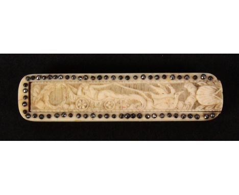 A 19th Century French carved bone needle or toothpick case, of rectangular form the sliding lid carved with a figure in a car