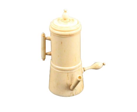 A fine early 19th Century ivory needle reel and thimble case, in the form of a chocolate pot, in two sections, the lower fitt