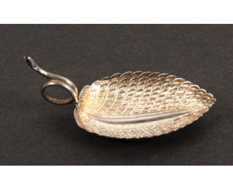 A silver caddy spoon, the leaf shaped and decorated bowl with the handle formed as an encircled snake, Birmingham, 1807, make