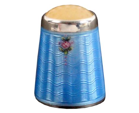 A Norwegian silver and enamel thimble, the blue ground with two small pink roses below the apex, moonstone top, internal apex