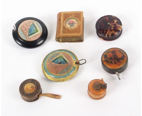 Seven tape measures, comprising a Mauchline ware example one side decorated with sea shells and seaweed, metal rim stamped Pa