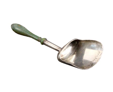 A silver caddy spoon, the shovel form bowl on turned tapering handle terminating in a green stained bone baluster handle, Bir