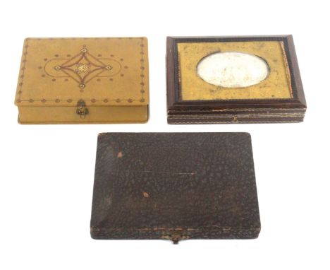 Three rectangular sewing companions, comprising a leatherette example, the engraved brass lid inset with an oval electrotype 