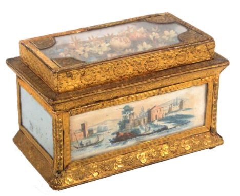 A good 19th Century French bonbonniere of elaborate rectangular form, the glazed lid with a display of cut paper flowers with