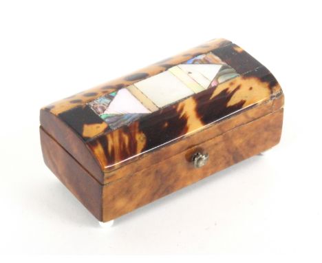 An early 19th Century tortoiseshell needle packet box, the domed lid inlaid with a panel of mother of pearl and abalone shell