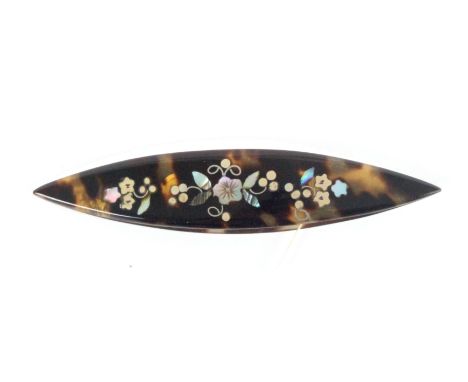 A small tortoiseshell tatting shuttle, one side inlaid in coloured metals and abalone with a panel of flowers and leaves, 7cm