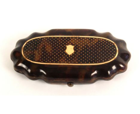 A mid 19th Century French tortoiseshell and gold inlaid etui, with silver gilt fittings, the case of shaped oval form, the li