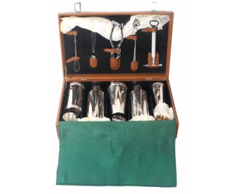 Asprey - London, a leather cased cocktail and drinks set in brown leather rectangular case, circa 1960, unused, initialled 'G