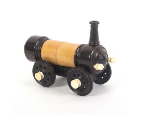 A rare crochet set contained in a model of a steam locomotive, in vegetable ivory, rosewood and bone, 10.5cms, the boiler end