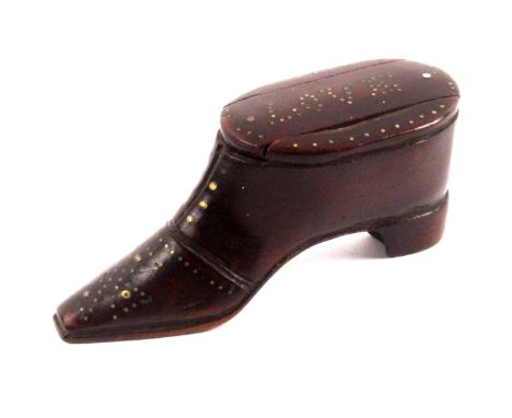 An early 19th Century mahogany shoe form snuff box, the flattened toe cap with Maltese cross style brass pique and other deta